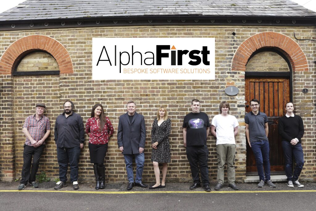 The AlphaFirst team outside the AlphaFirst office